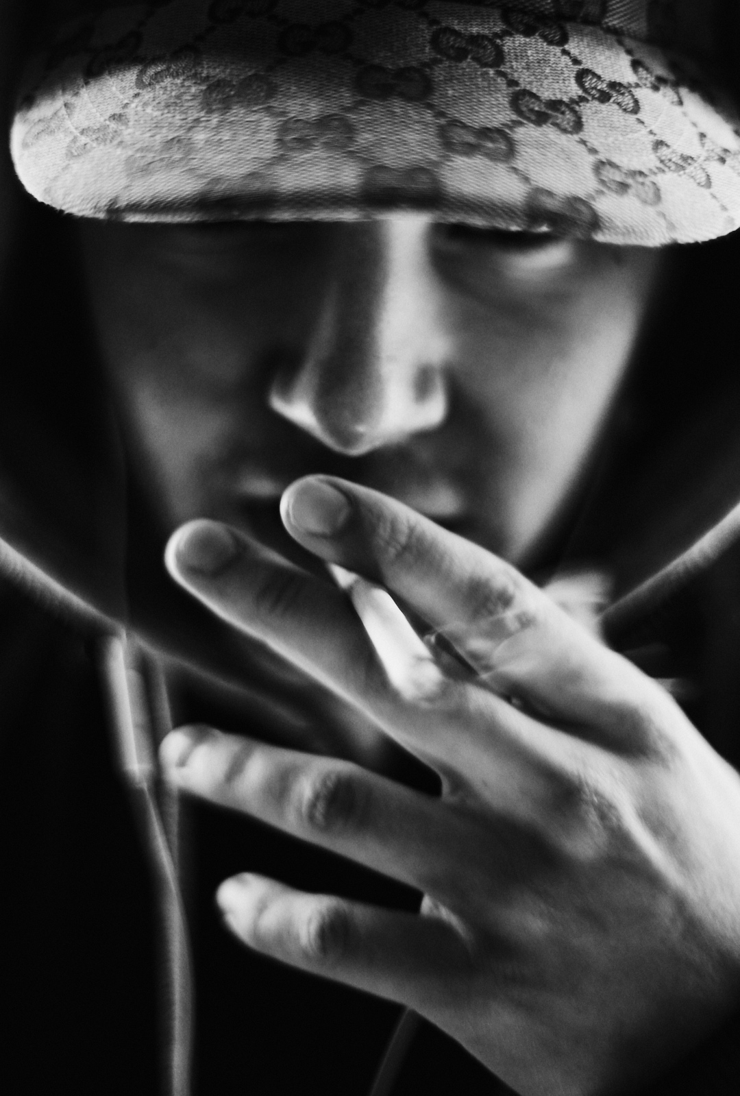 black and white portrait man lace cap smoking fashion editorial