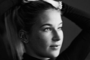 freckled girl portrait black and white natural light close up
