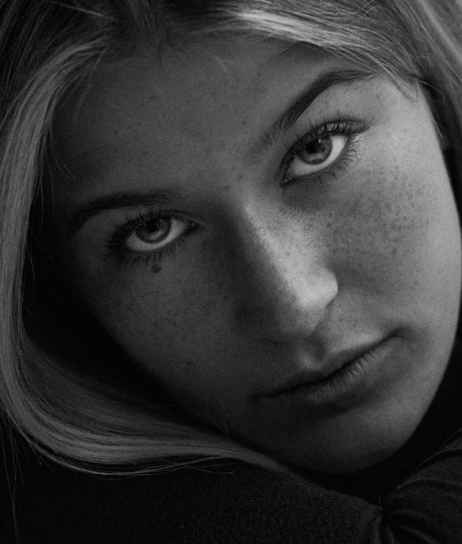 young girl soft light portrait cinematic black and white
