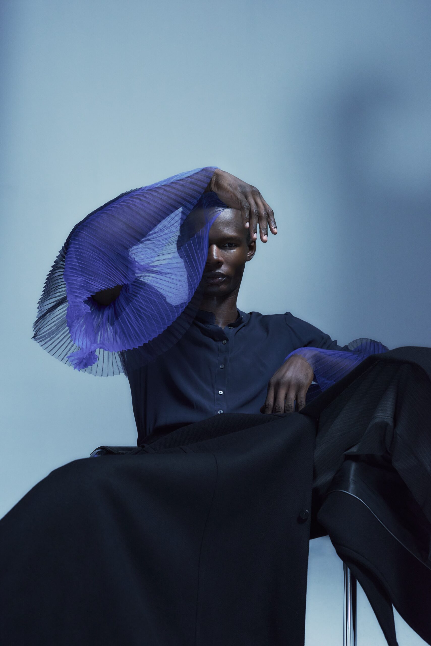 male model blue outfit studio clean background fashion portrait