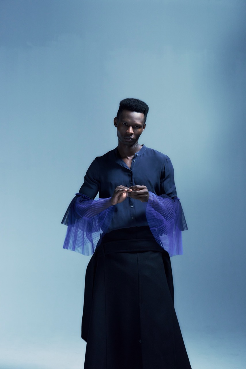 male model standing studio motion blur fashion photography
