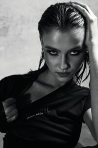 female model wet hair intense look black and white beauty