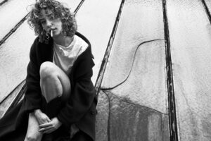 black and white rooftop portrait woman coat urban fashion photography