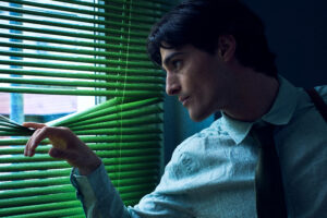 male model blue shirt office blinds green light cinematic fashion