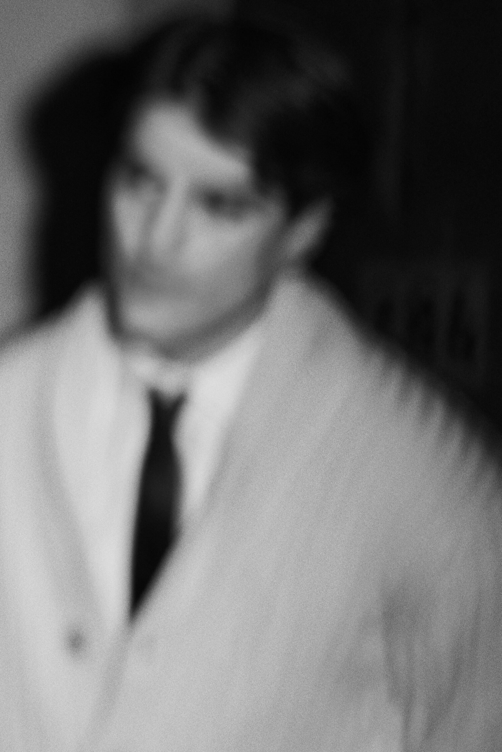 blurred male portrait soft focus black and white fashion photography
