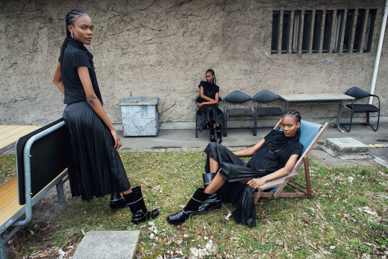 female models sitting outdoor urban location fashion editorial
